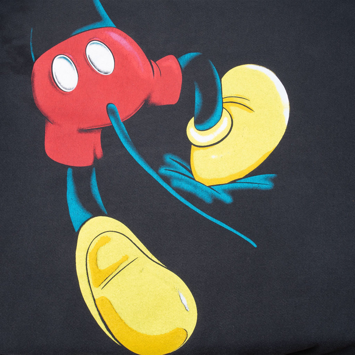 Close-up of Mickey Mouse red shorts and yellow shoes graphic on sweatshirt back