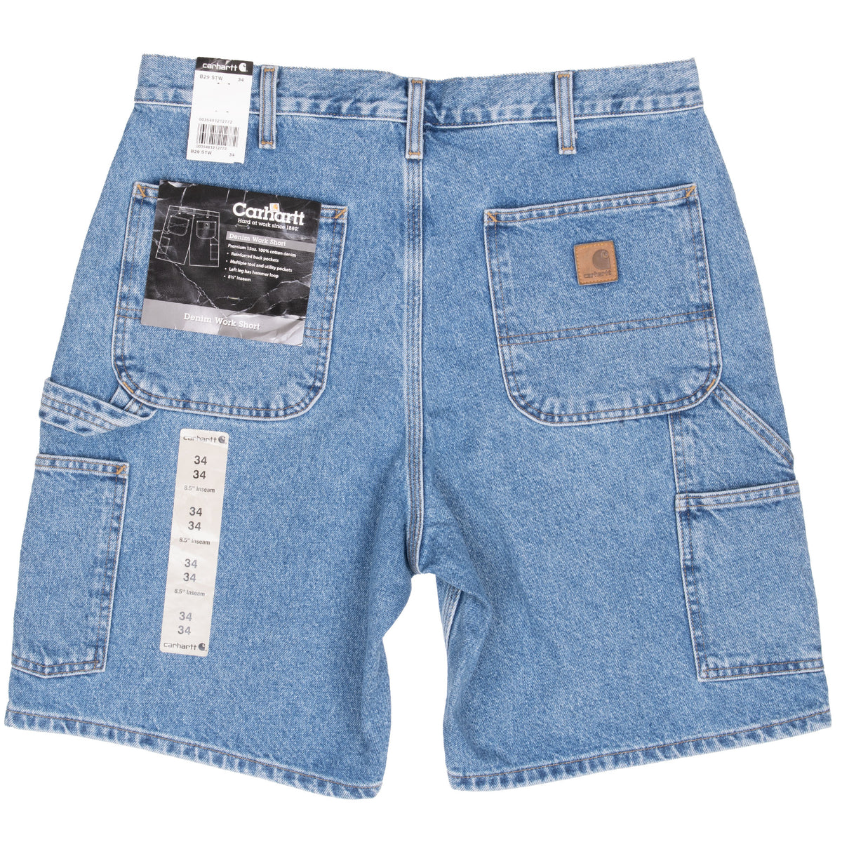Back of Carhartt blue denim carpenter shorts with pockets and retail tags