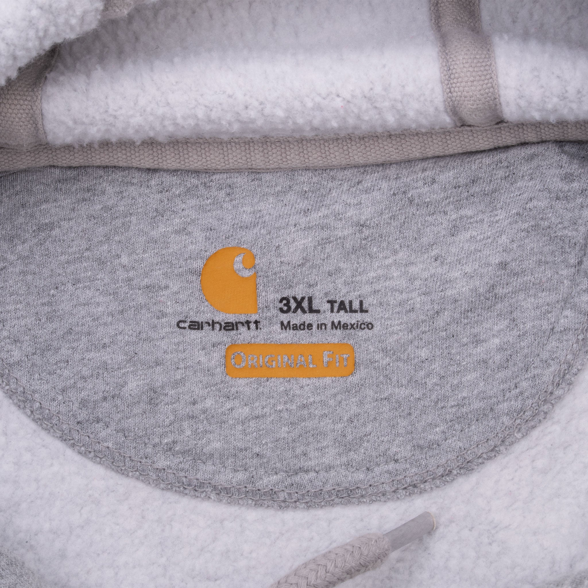 Carhartt neck print showing 3XL Tall, Original Fit and Made in Mexico