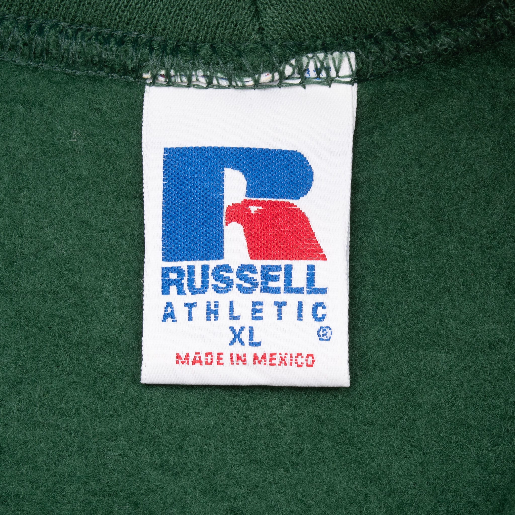 Russell Athletic XL neck tag inside green pullover hoodie