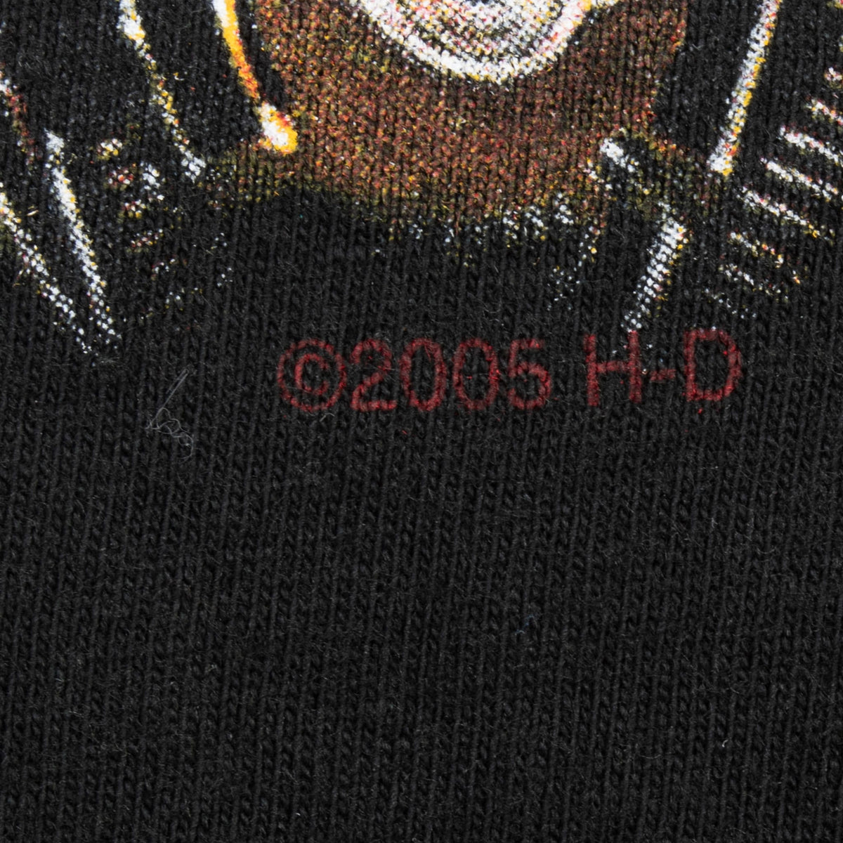 Close-up of 2005 Harley-Davidson copyright mark printed on black fabric