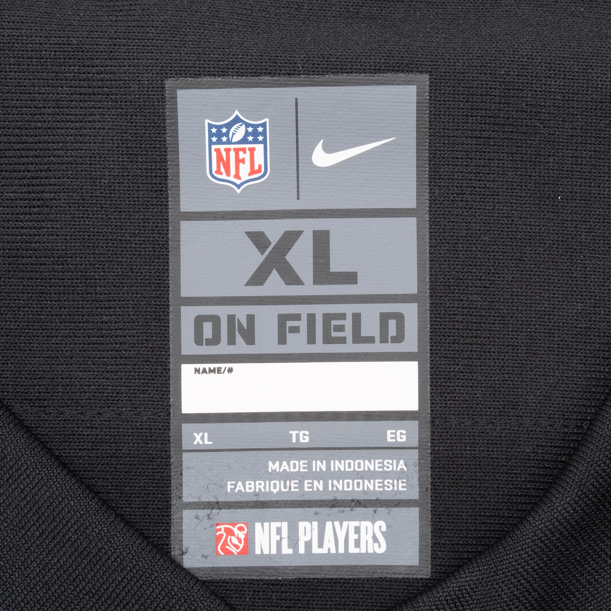 Nike NFL On Field XL neck label on black jersey fabric