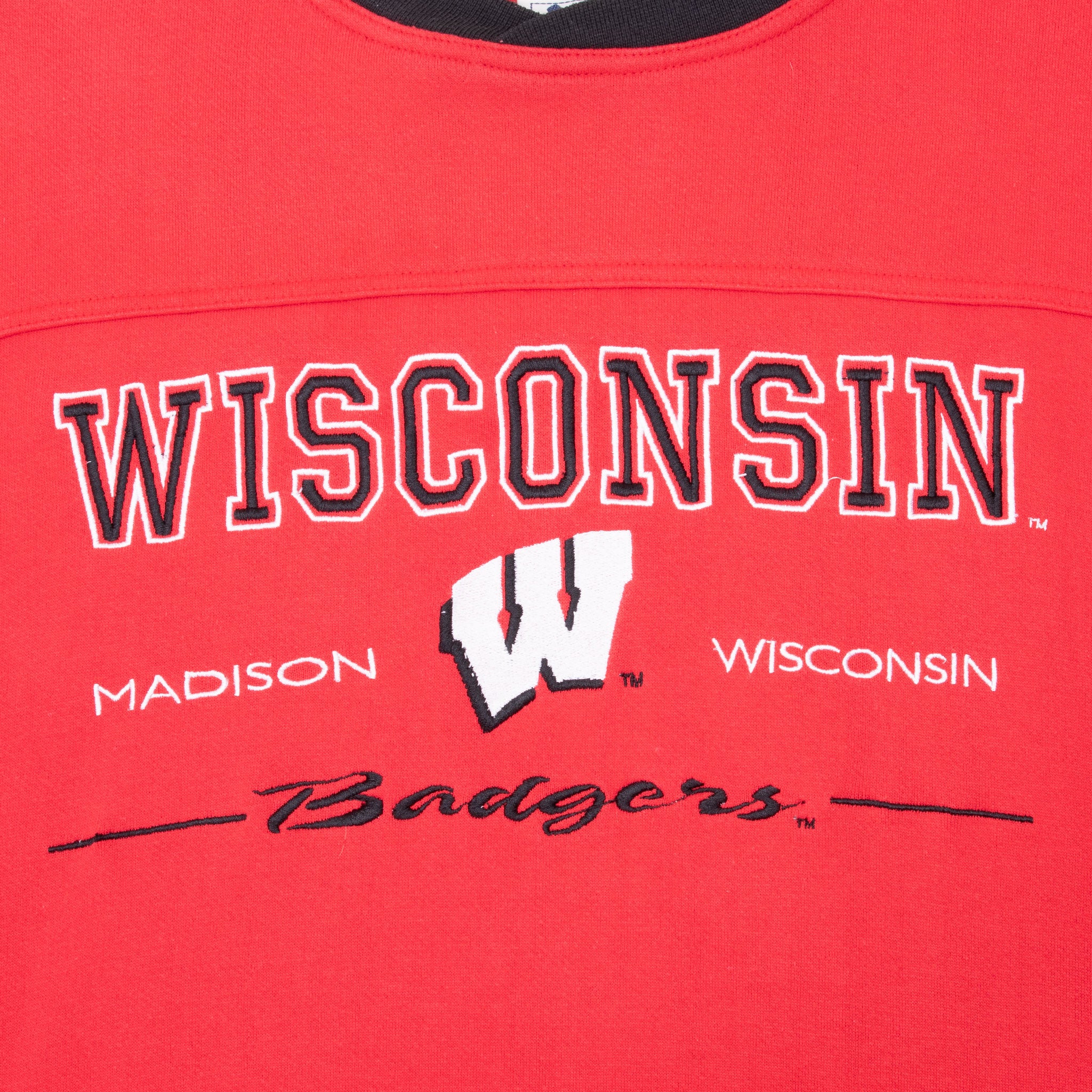 Close-up of Wisconsin Badgers lettering and W logo embroidery
