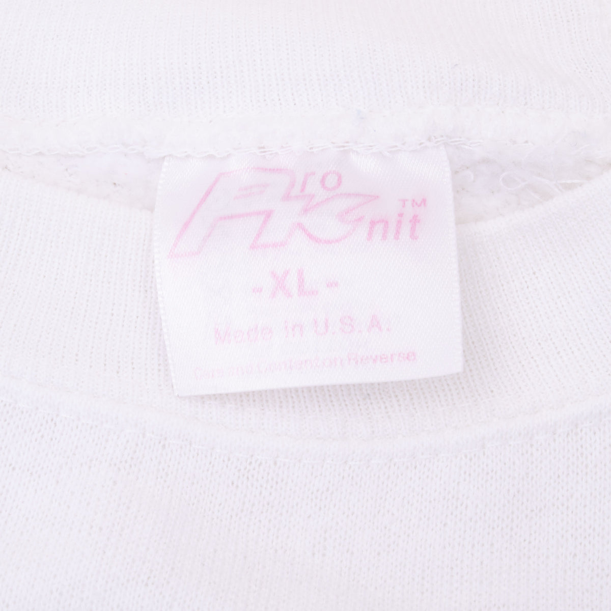 Pro Knit XL Made in U.S.A. neck tag on white sweatshirt