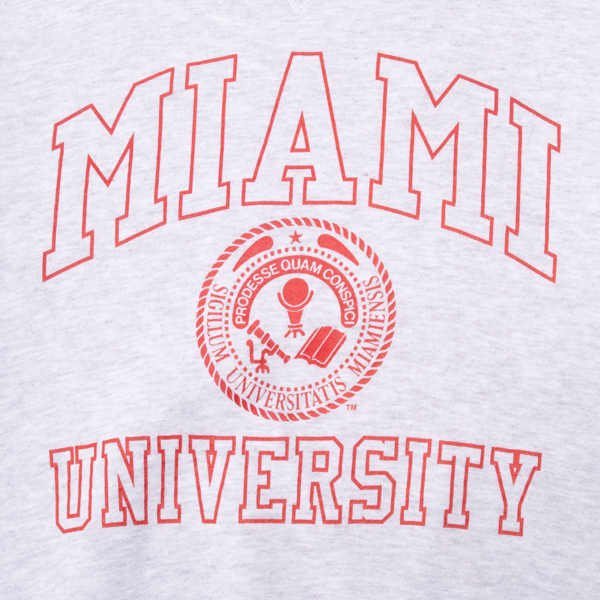 Close-up of red Miami University lettering and seal printed on gray sweatshirt
