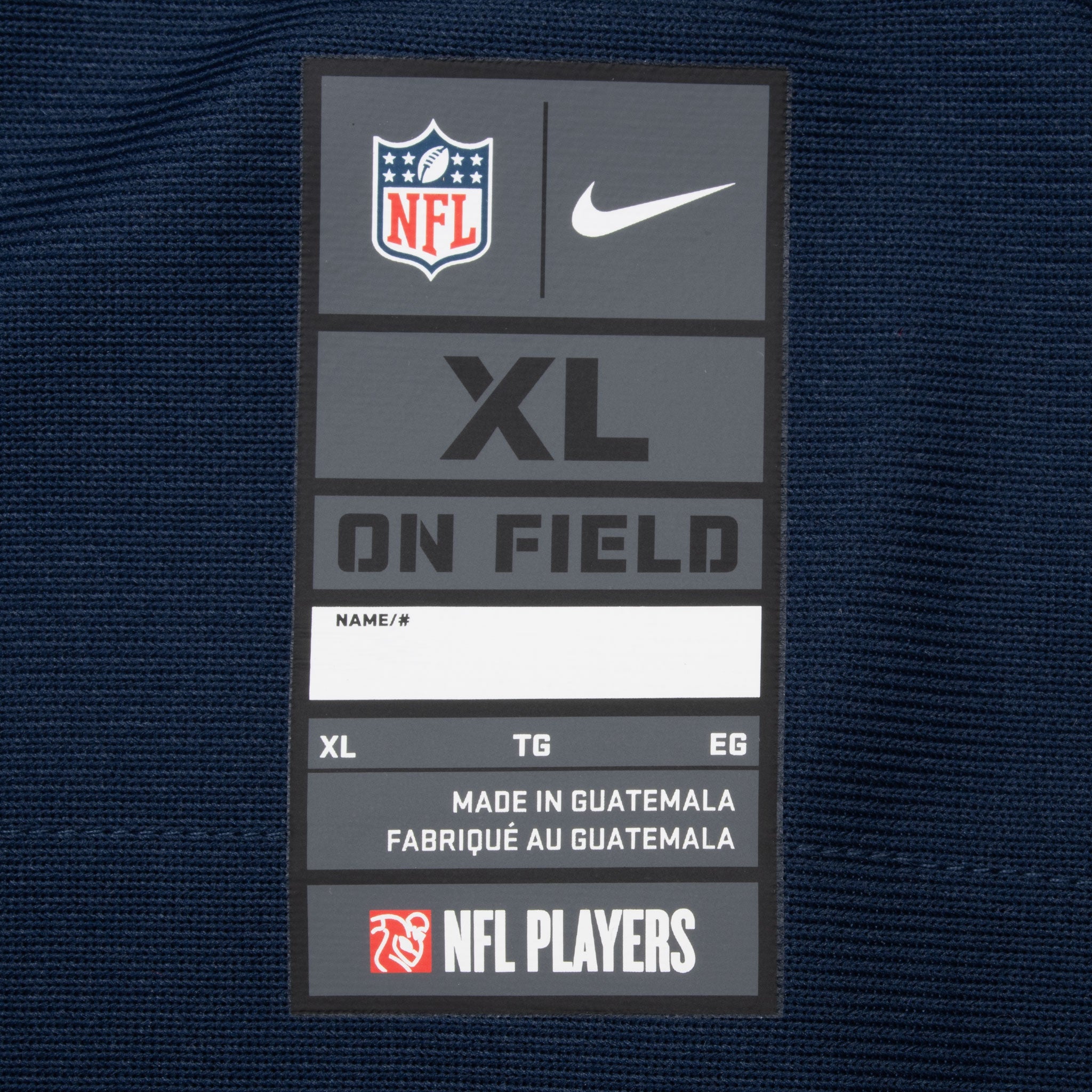 Nike NFL XL neck tag on navy Dallas Cowboys jersey
