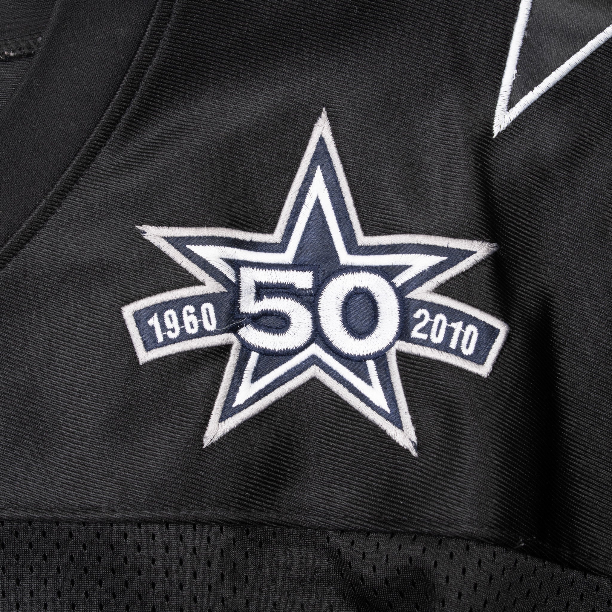 Close-up of embroidered Dallas Cowboys 1960–2010 50th anniversary star patch