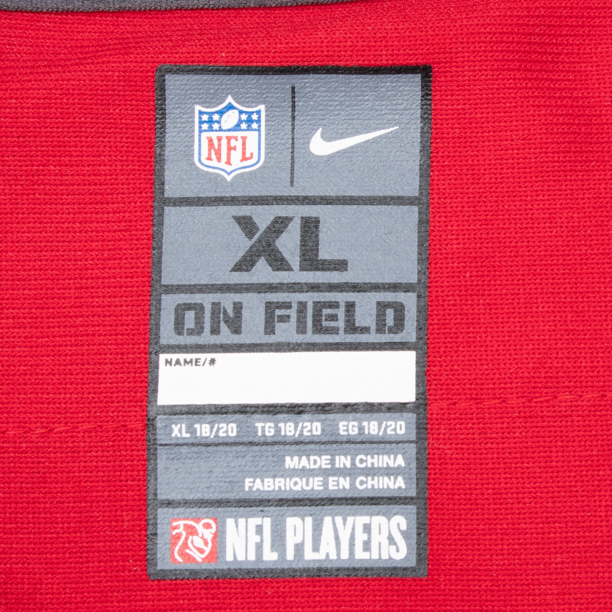 Close-up of Nike NFL On Field youth XL neck label