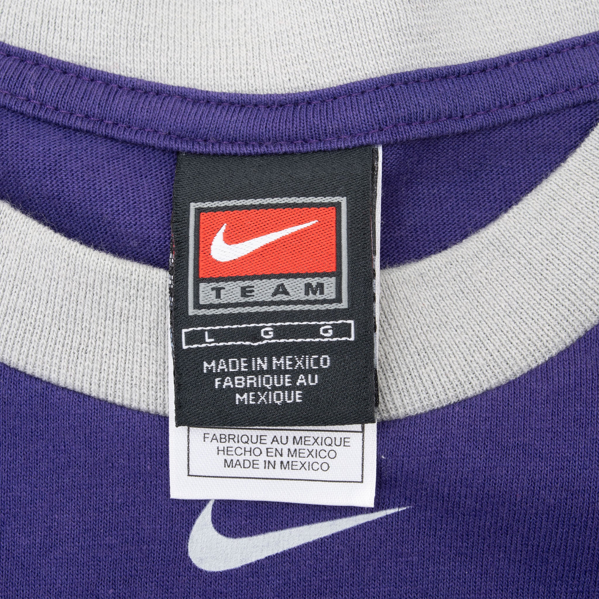 Nike Team neck tag and gray ringer collar detail on purple Kansas State T-shirt