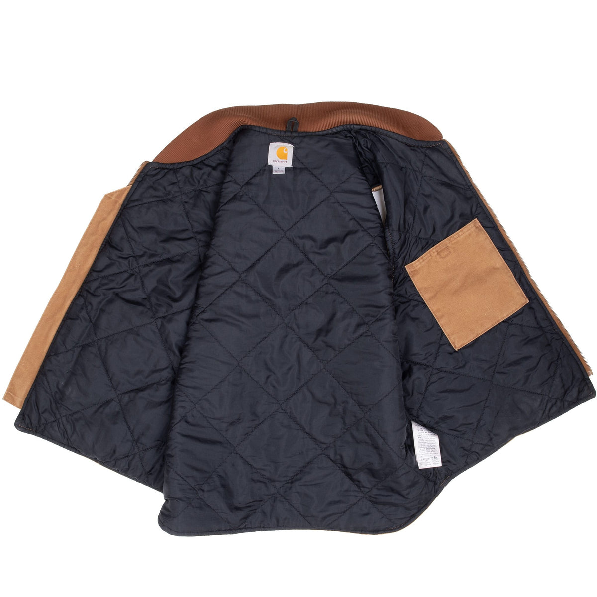 Open Carhartt vest showing dark diamond-quilted lining and interior pocket