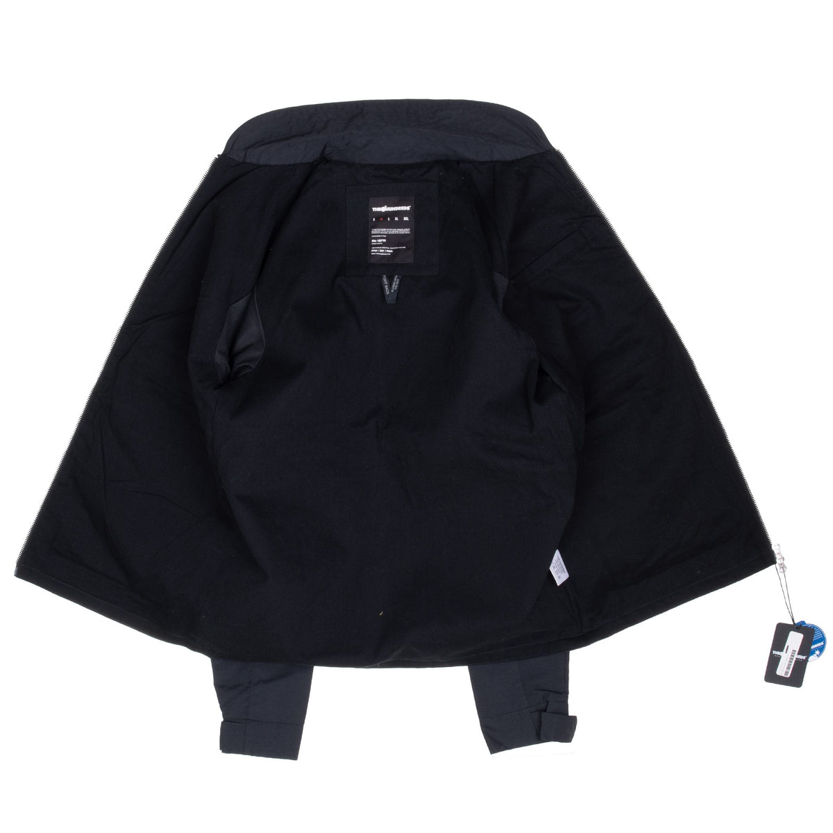 Open interior of The Hundreds Bestwick black windbreaker showing label and hangtags