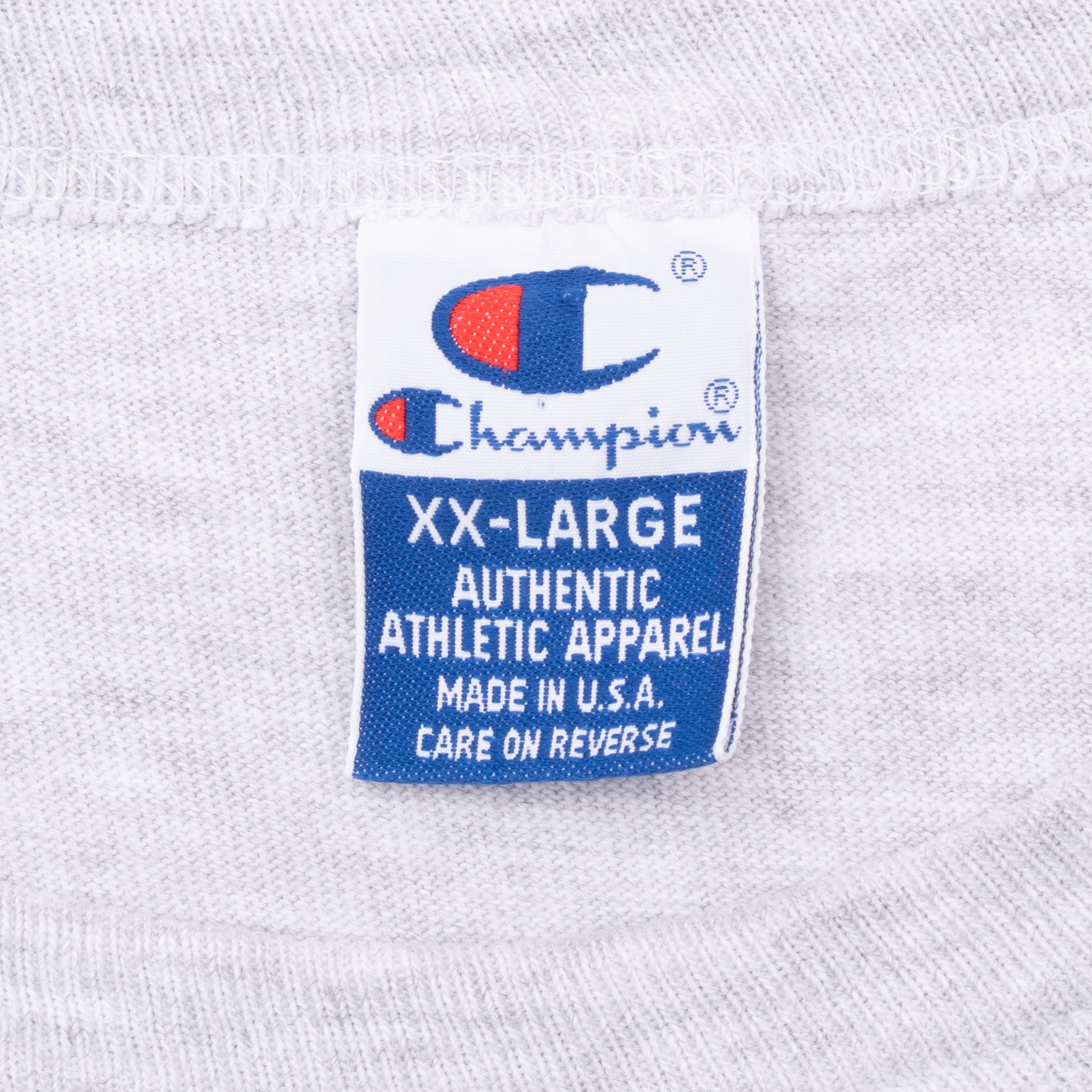 Champion XX-Large Made in U.S.A. neck label on gray T-shirt