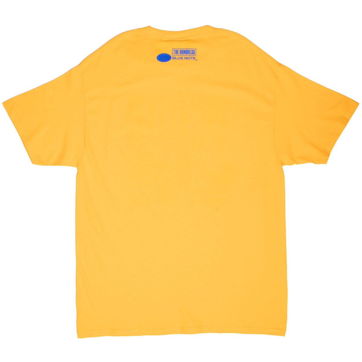 Back of yellow T-shirt with The Hundreds and Blue Note logos below the neckline