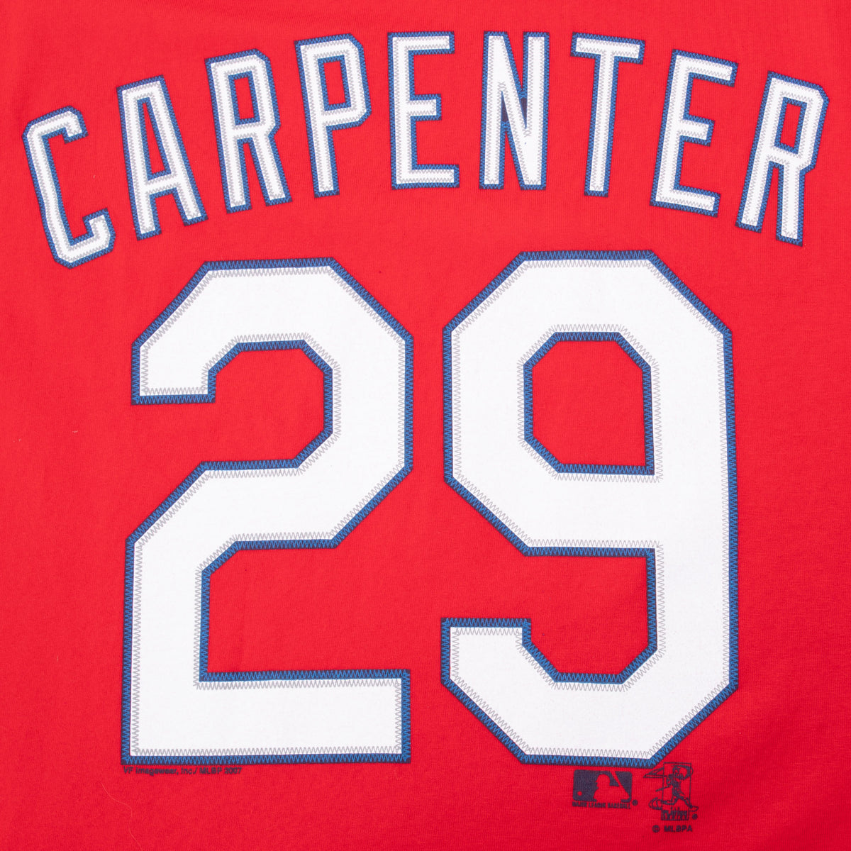 Close-up of Carpenter name and number 29 on back of red Cardinals T-shirt