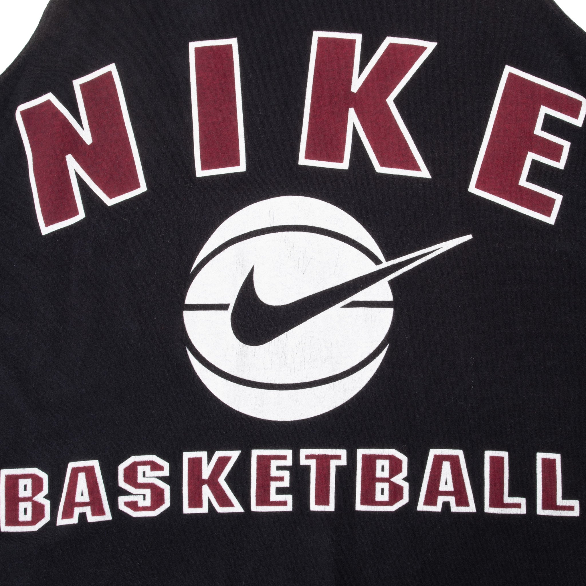Close-up of burgundy Nike lettering, Swoosh basketball, and Basketball print