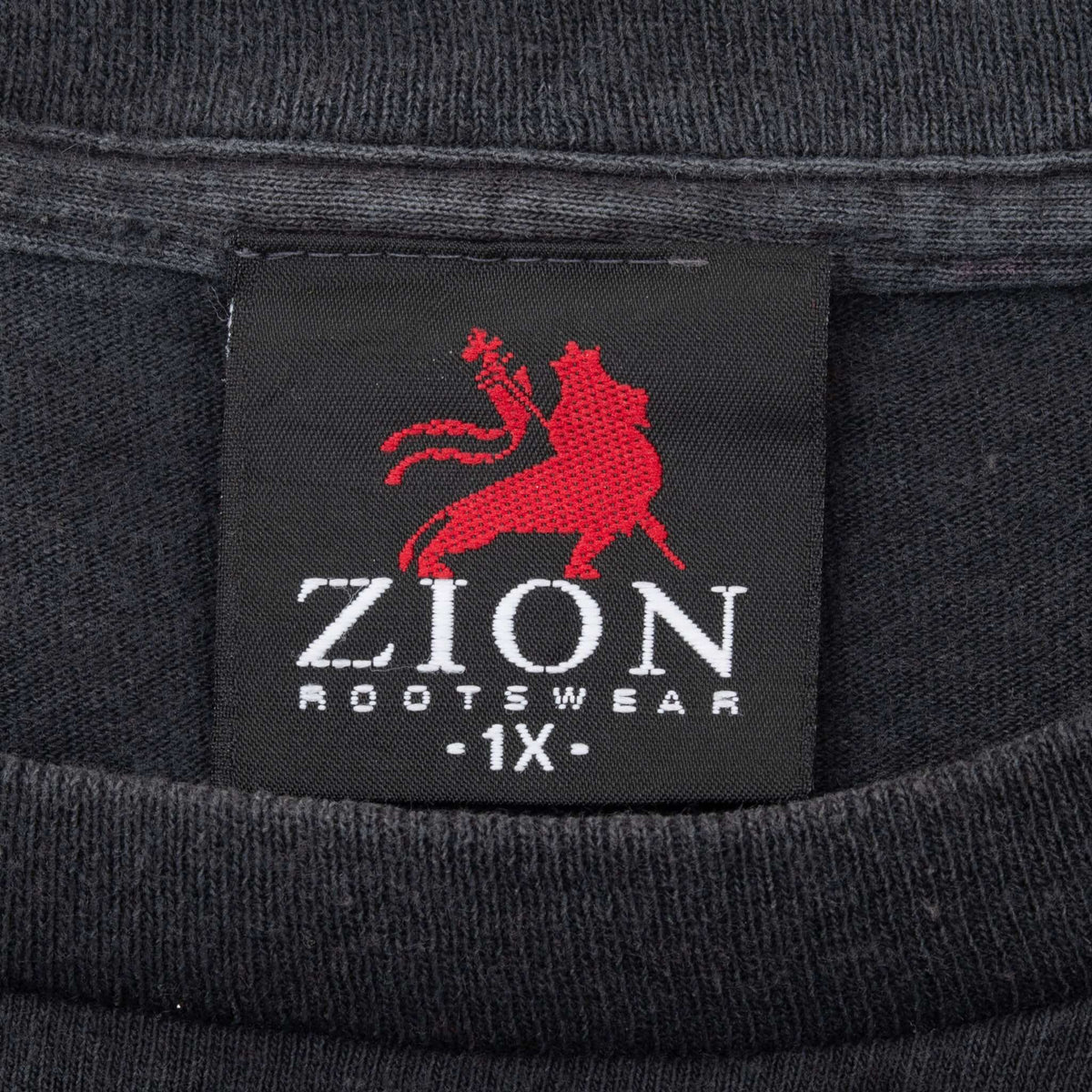 Zion Rootswear 1X neck label on black Bob Marley T-shirt