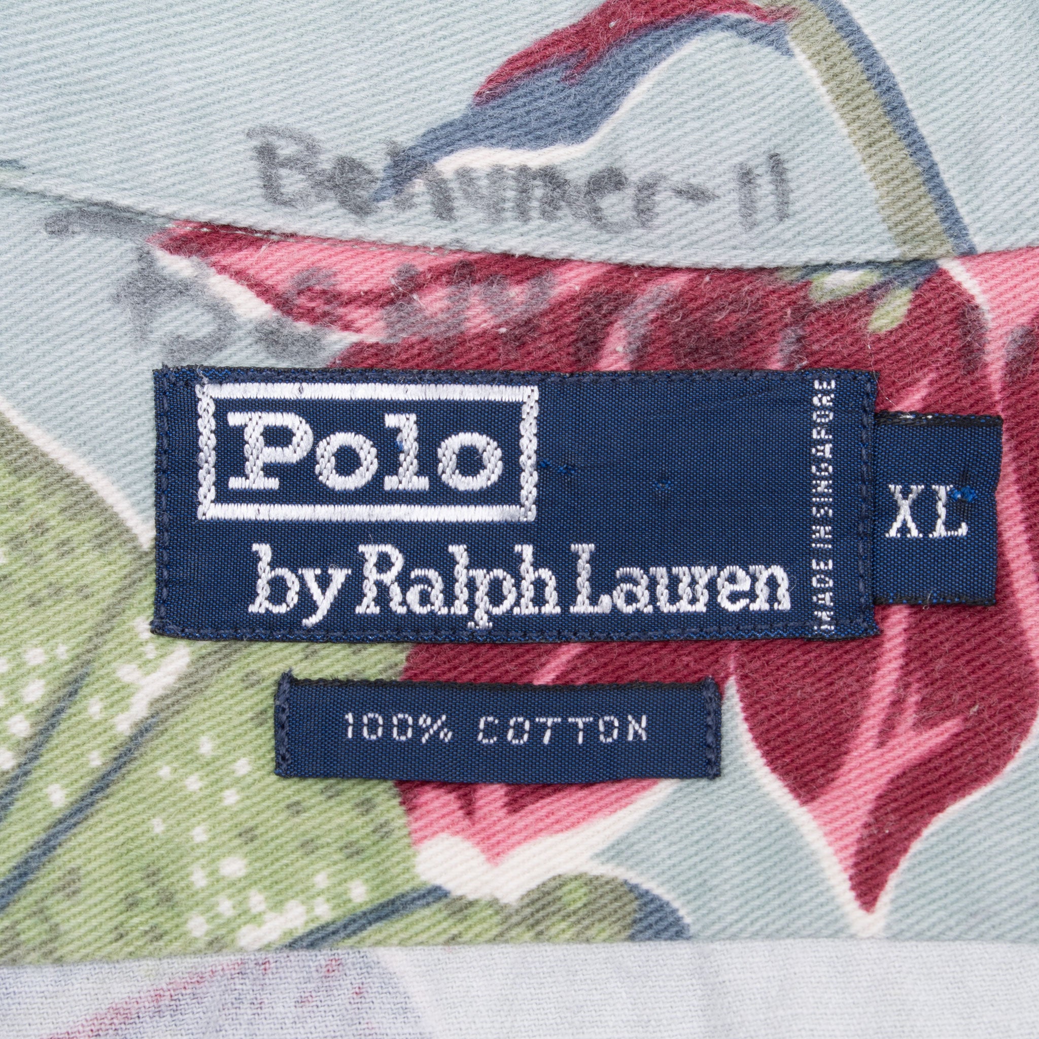 Polo by Ralph Lauren collar label with XL size tag and handwritten name above