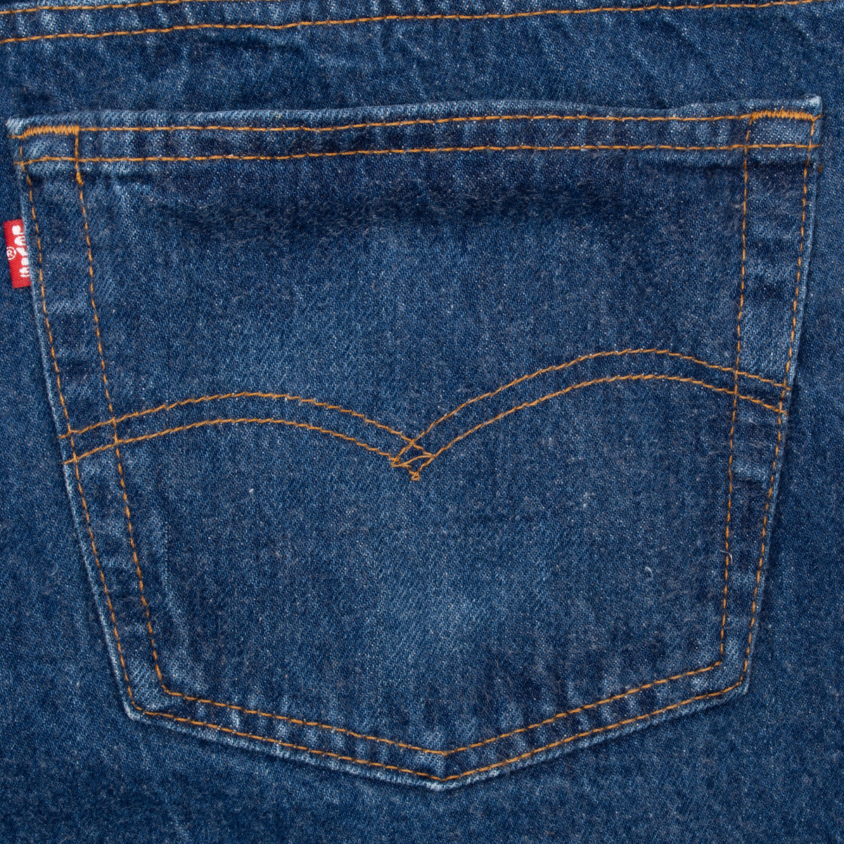 Levi's 501 back pocket with orange arcuate stitching and red tab