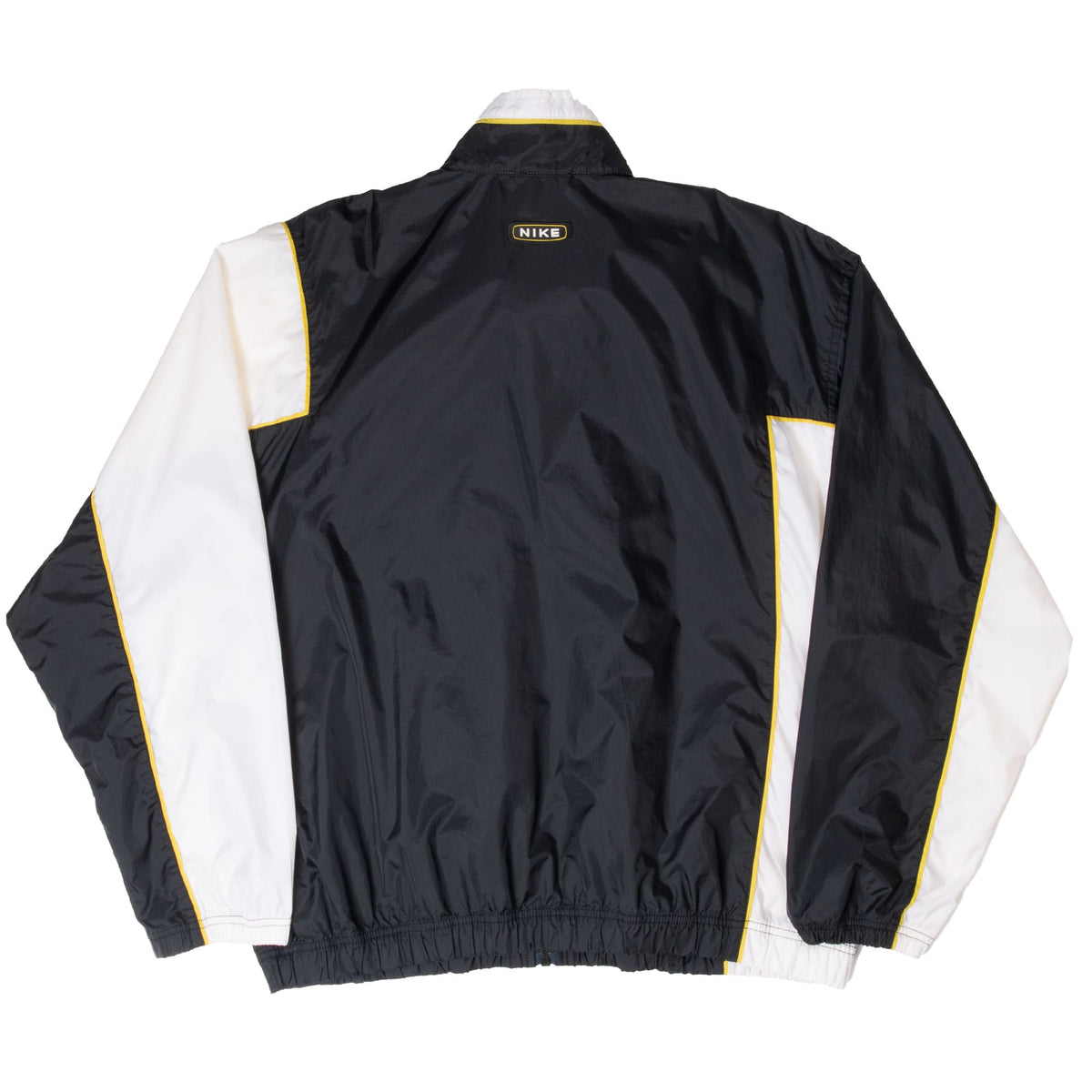 Back of black Nike windbreaker with white sleeve panels, yellow piping and upper Nike patch