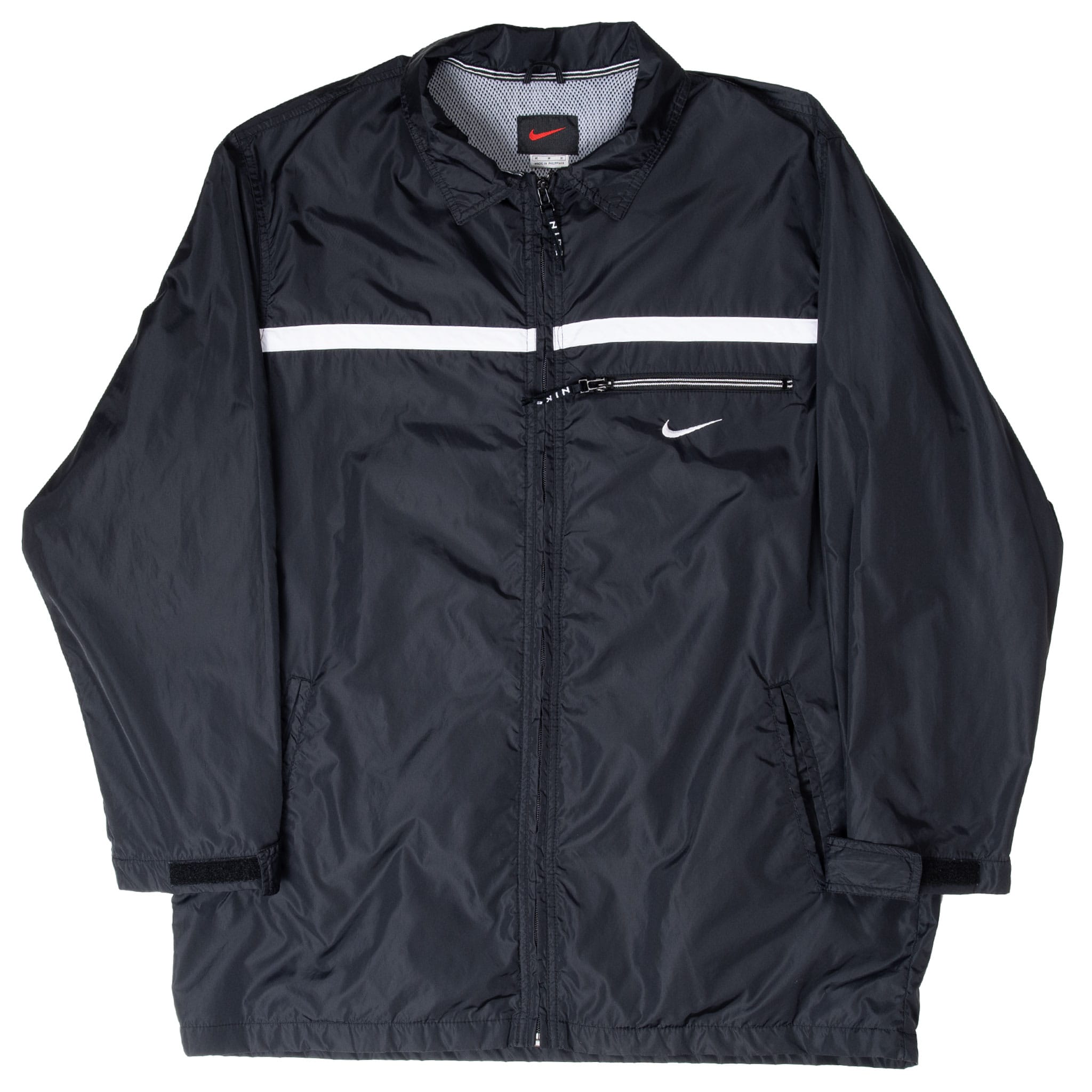 Full front view of black Nike zip-up windbreaker with white chest stripe and angled pockets