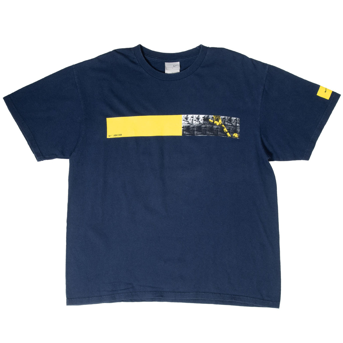 Full front of navy Nike soccer T-shirt with chest graphic and yellow sleeve detail