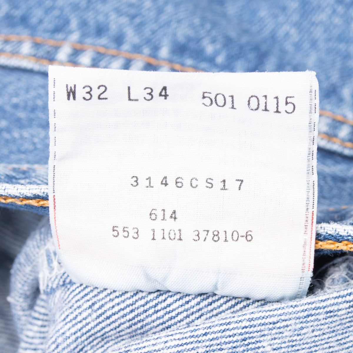 Levi's 501 inner tag marked W32 L34, 501 0115 and 553