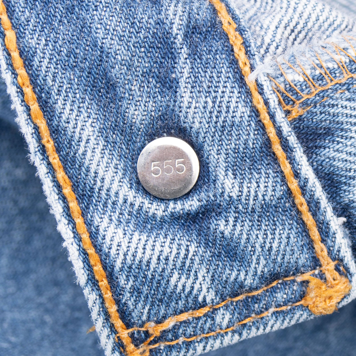 Close-up of Levi's 501 inner button stamped 555