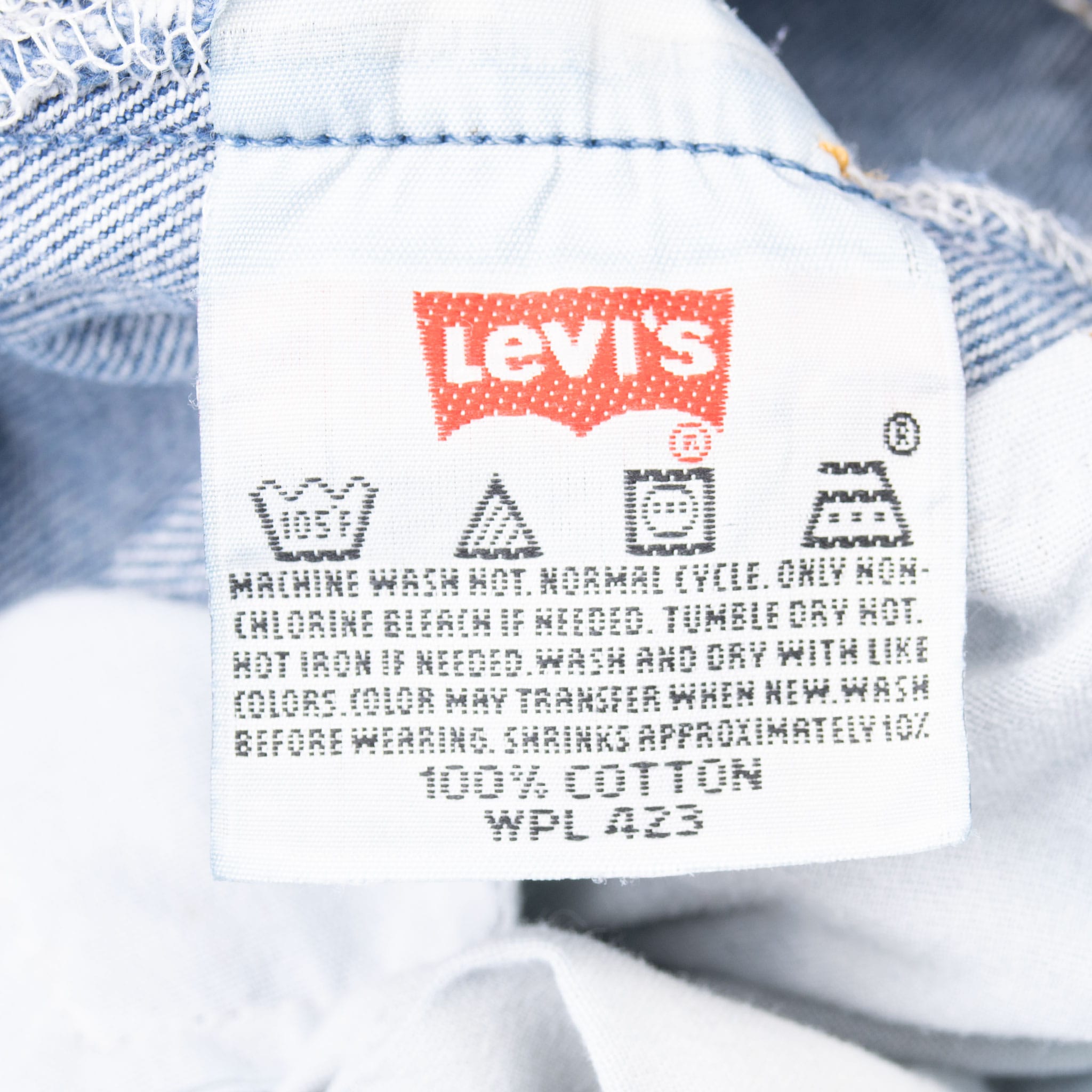 Levi's care label with washing instructions and 100% cotton content