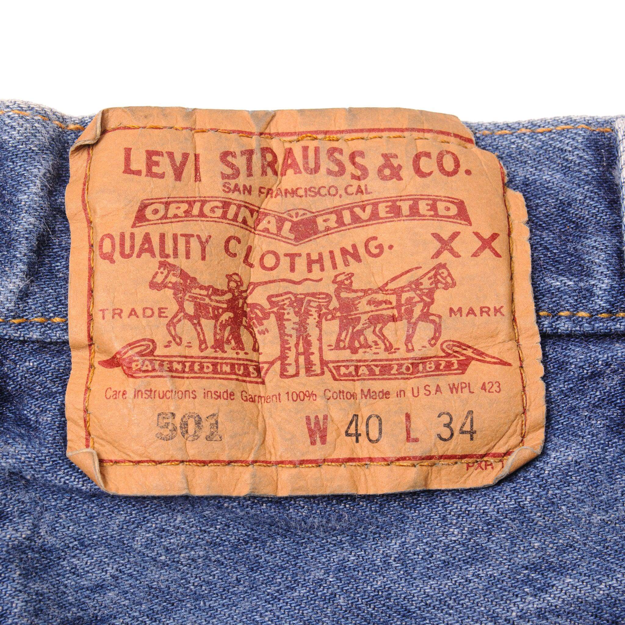 Beautiful Indigo Levis 501 Jeans Made in USA with a medium blue wash, some nice contrast between light and medium blue and some very light whiskers. Size on Tag 40X34 ACTUAL SIZE 38X32 Back Button #511