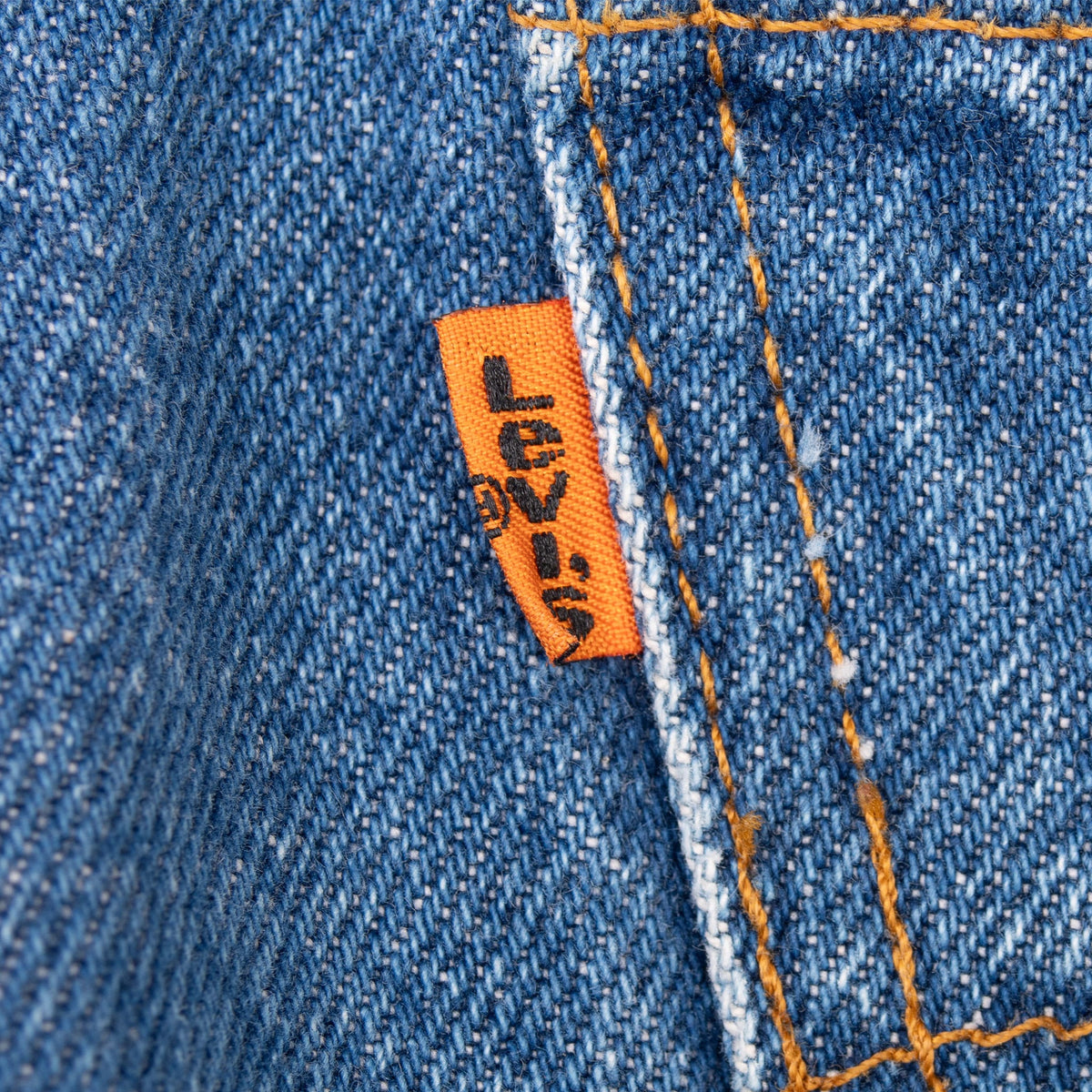 Close-up of the orange Levi's tab on blue denim