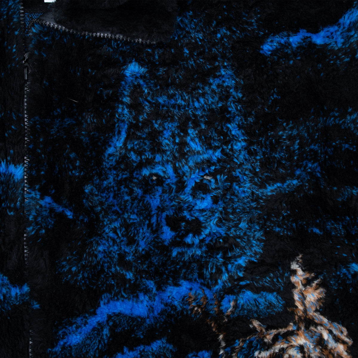 Close-up of blue wolf print on black plush fleece