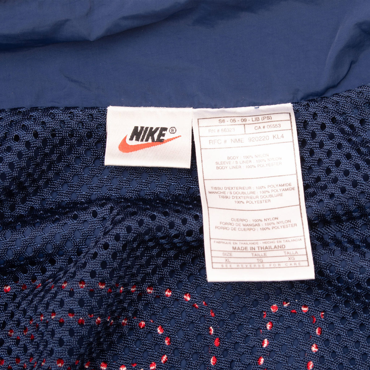 Interior Nike neck and care labels on navy mesh lining