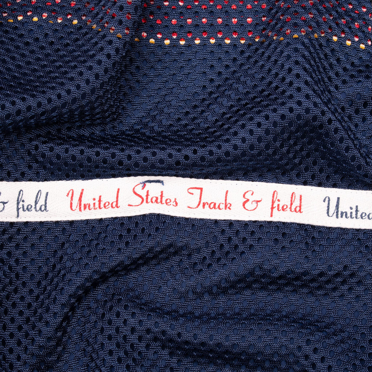 Interior United States Track & Field ribbon detail on navy mesh lining