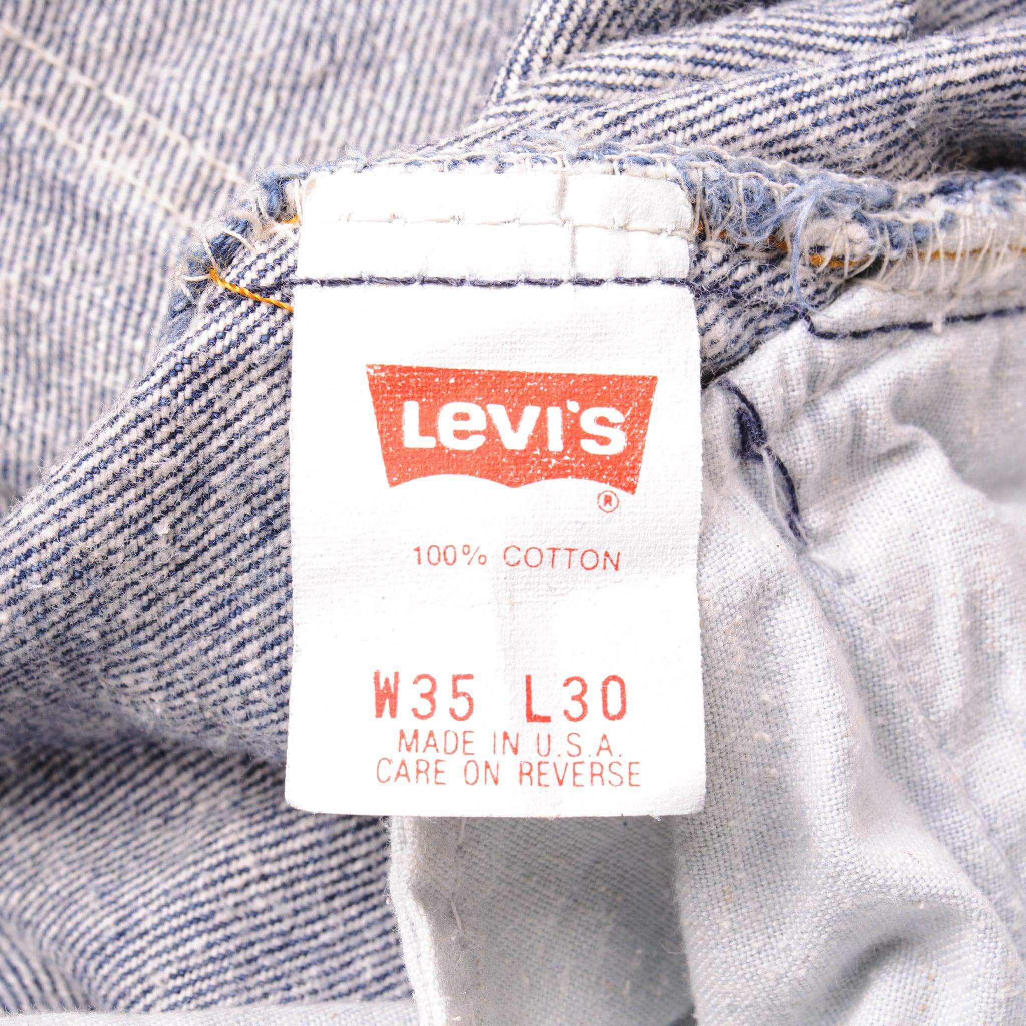 Beautiful Indigo Levis 501 Jeans 1990's Made in USA with a dark wash. Size on Tag 35X30 ACTUAL SIZE 33X29 Back Button #553