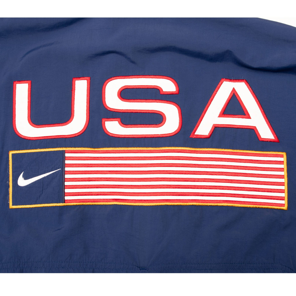 Close-up of back USA lettering and striped flag graphic with Nike Swoosh