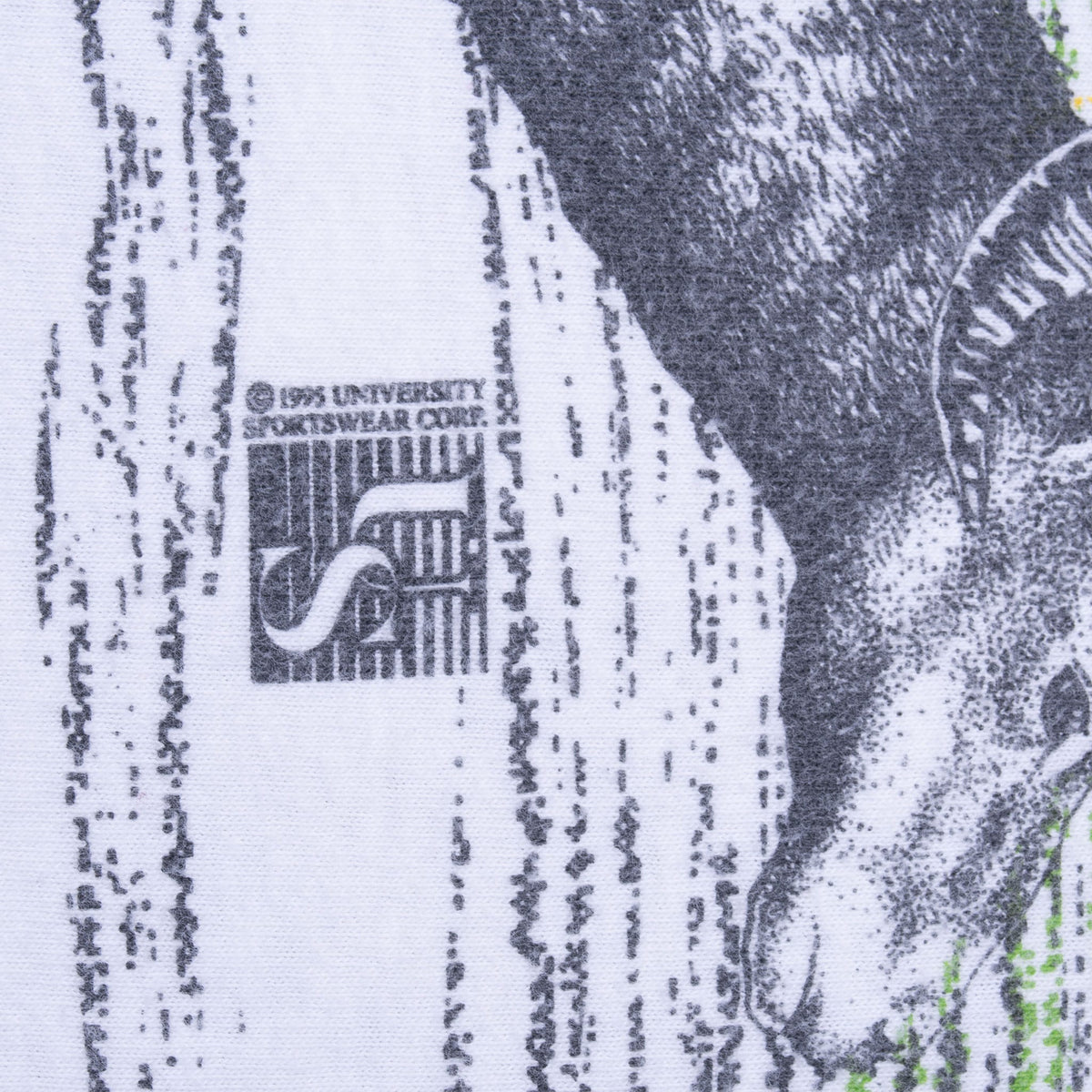 Close-up of 1995 Universal Sportswear copyright mark within the wildlife print
