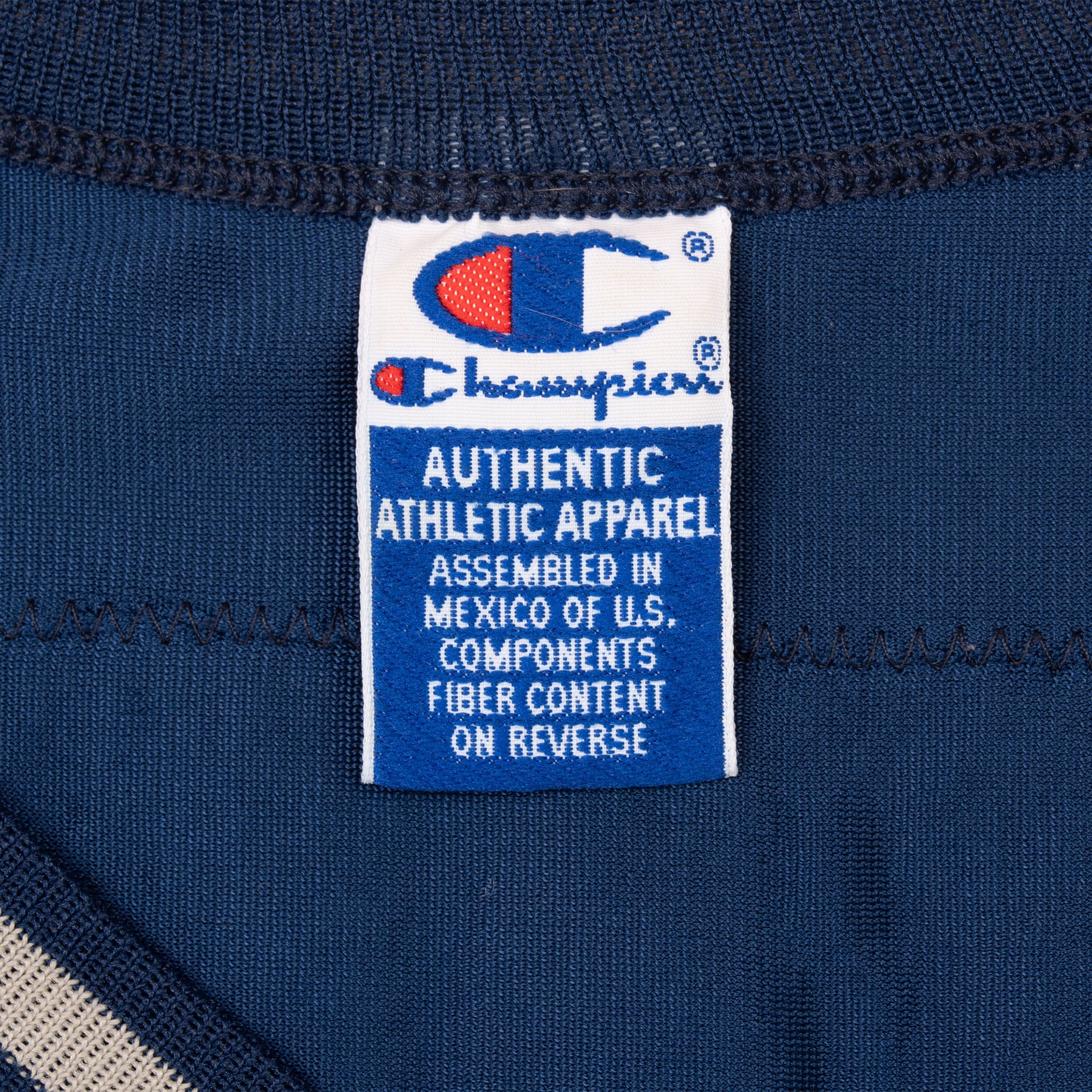 Champion neck label inside navy Troy Aikman Dallas Cowboys jersey
