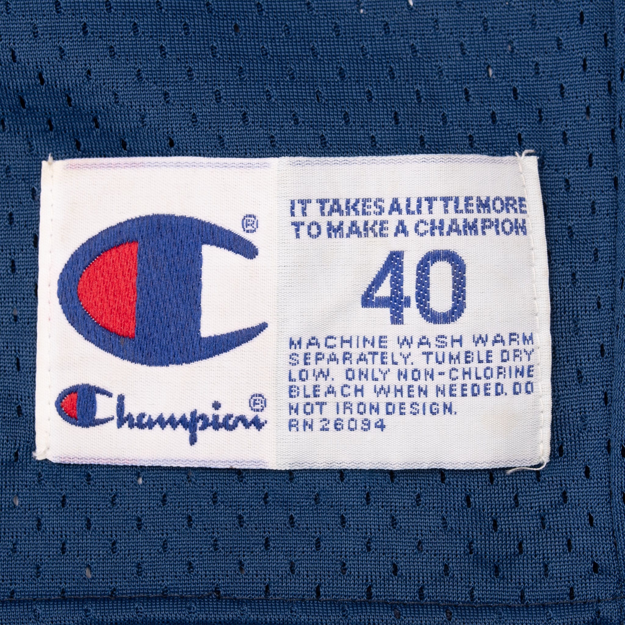 Champion size 40 jock tag at hem of navy mesh Dallas Cowboys jersey