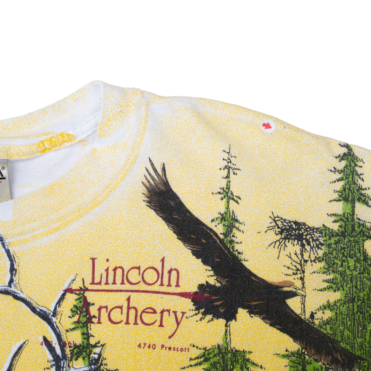 Upper front detail with Lincoln Archery logo, flying eagle, trees and yellow speckled background