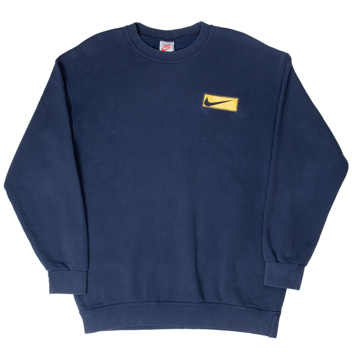 Full front of navy Nike crewneck sweatshirt with yellow Swoosh patch and ribbed trim