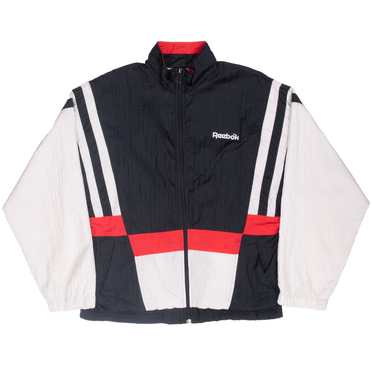 Full front view of black Reebok zip-up windbreaker with white sleeves and red color blocking
