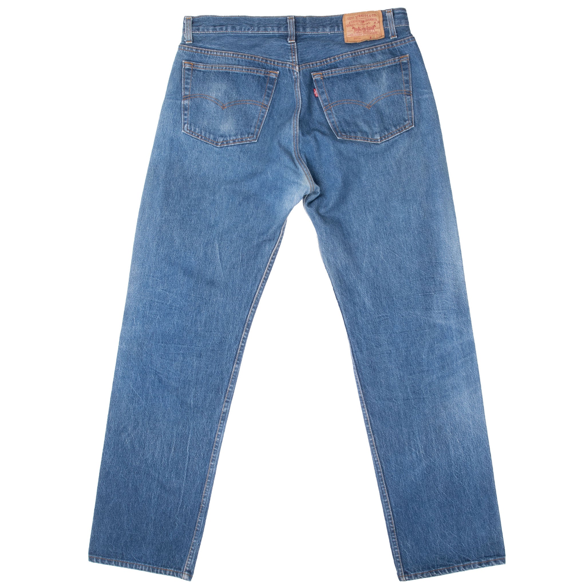 Blue jeans on a white background Vintage Levis 501 Indigo Blue Jeans 1980S Size 36X33 Made In Usa With A Medium Light Wash With Some Light Whiskers
Size on Tag 38X36 Actual Size 36X33
Back Button #522