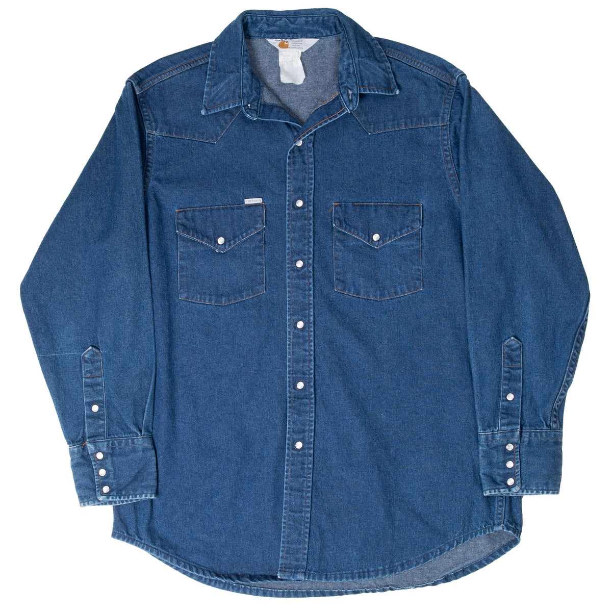 Front view of blue Carhartt Western denim shirt with pointed yoke and curved hem