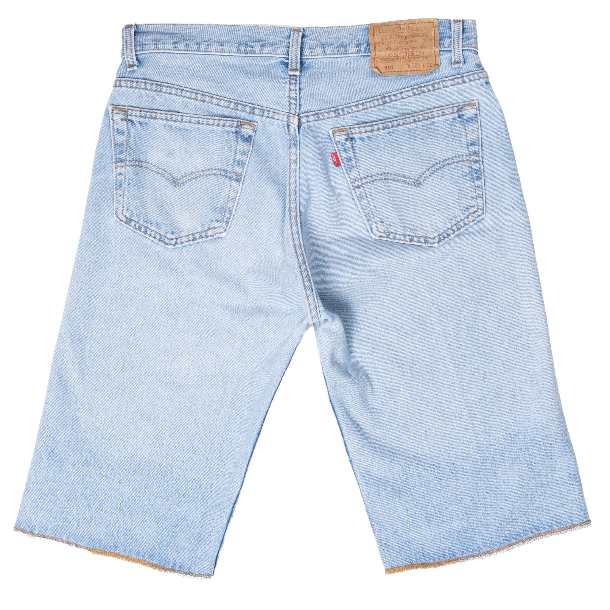 Back of Levi's 501 light indigo denim shorts with arcuate-stitched pockets, red tab, and waist patch