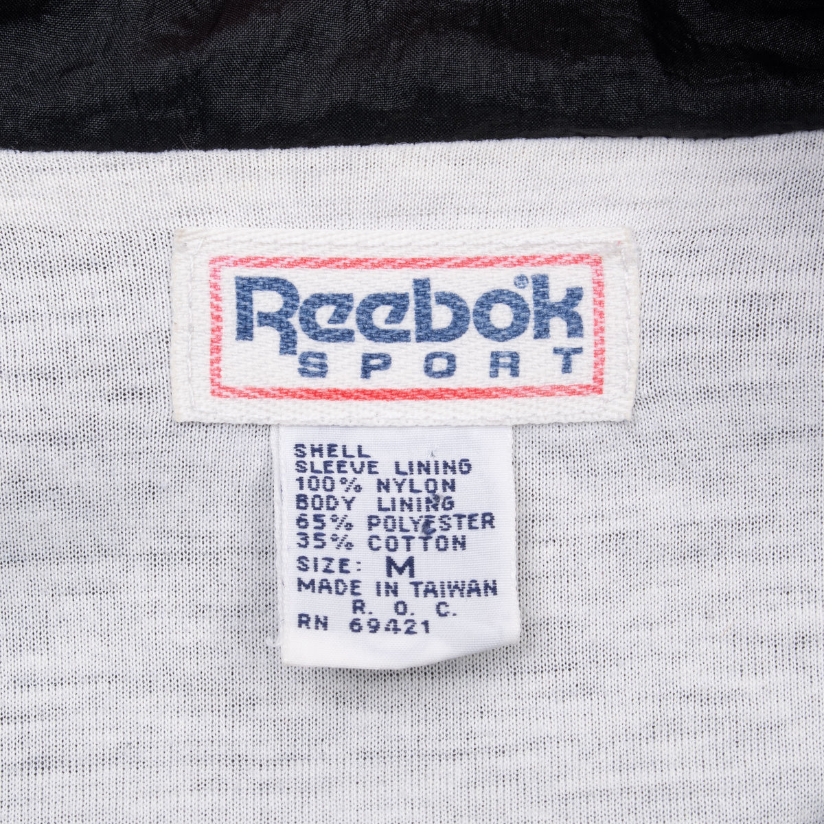 Reebok Sport neck and care labels showing size M