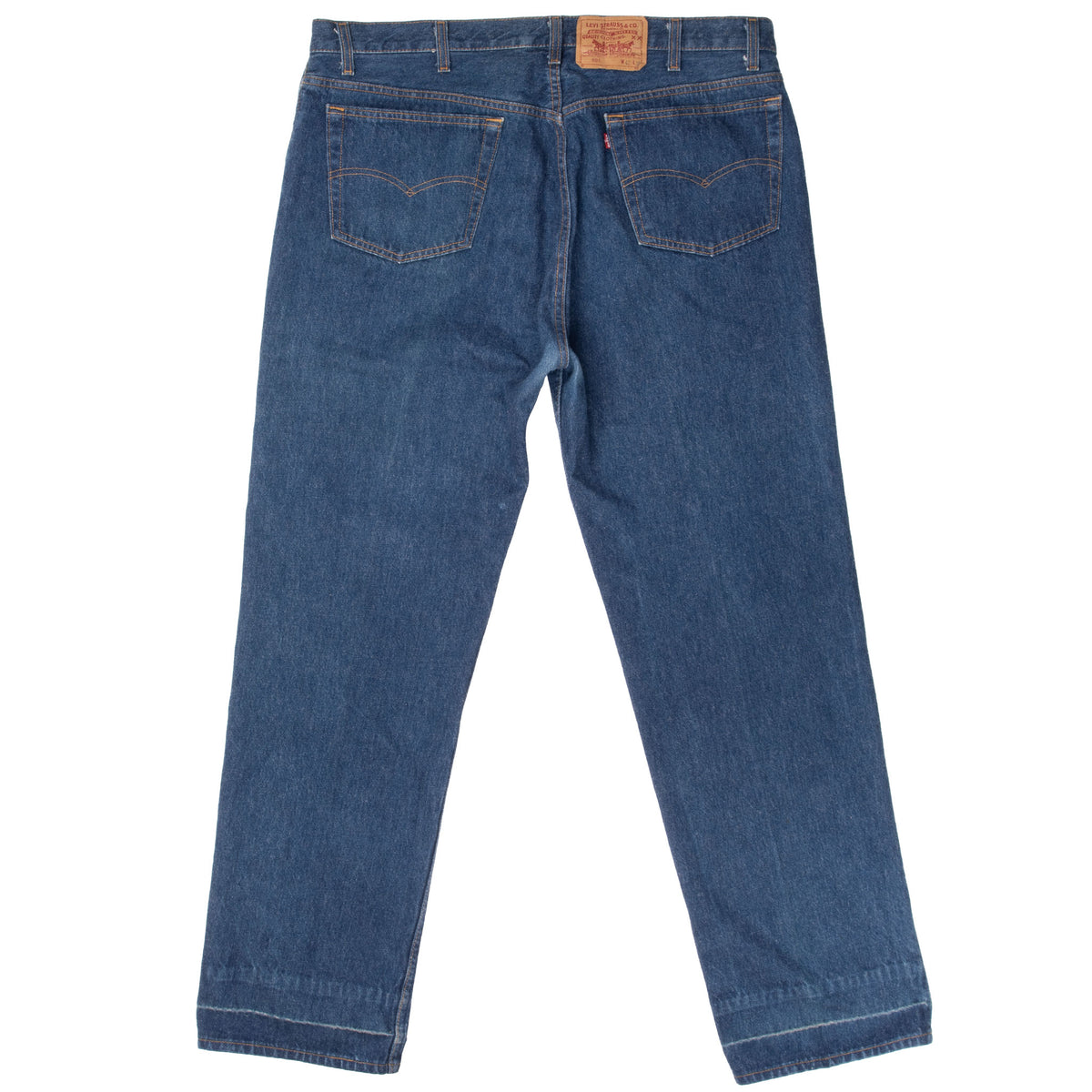 Back view of Levi's 501 indigo blue jeans with two patch pockets and waistband label