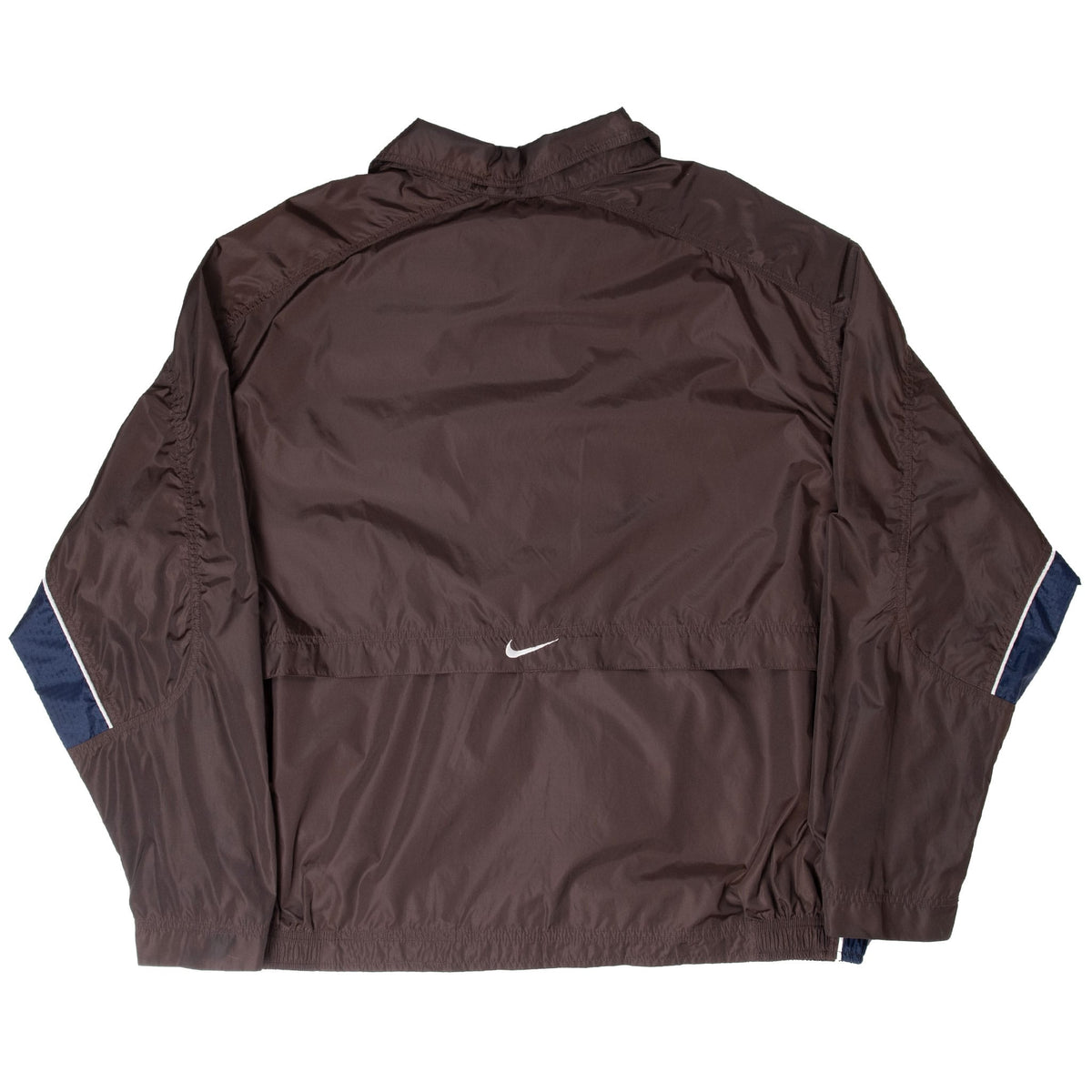 Back of brown Nike windbreaker with white embroidered Swoosh and navy sleeve panels