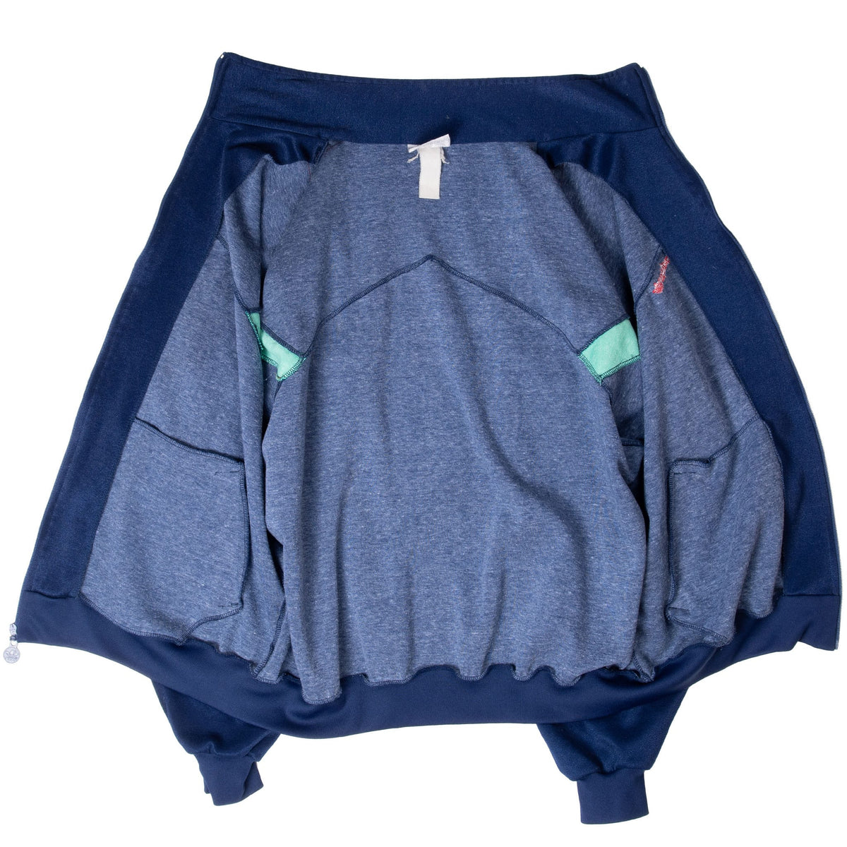 Interior view of unlined navy adidas Jamaica track jacket