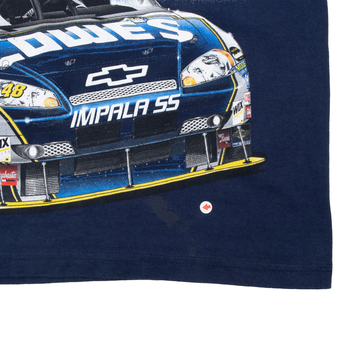 Lower front detail of Lowe's No. 48 Impala SS print with arrow marking a spot on the navy fabric