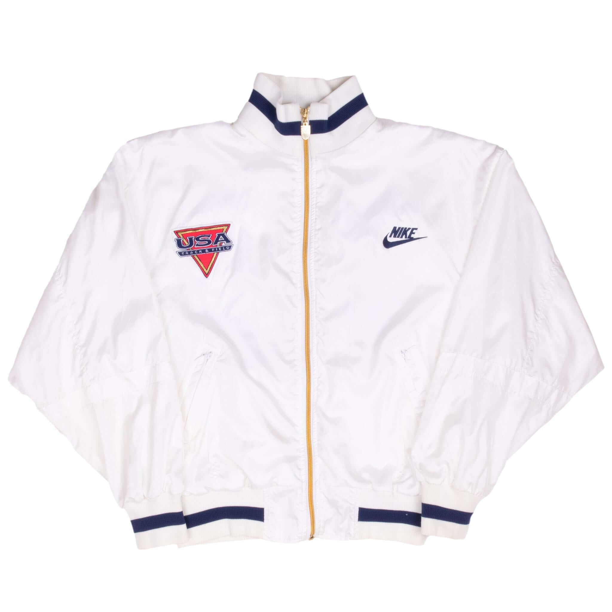 Full front view of white Nike USA Track & Field zip jacket with navy striped trim